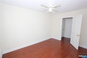Bedroom with closet and ceiling fan