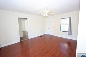 Corner room with wood floors and doorways