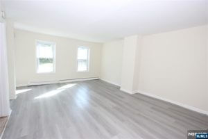 Empty living room with gray floors